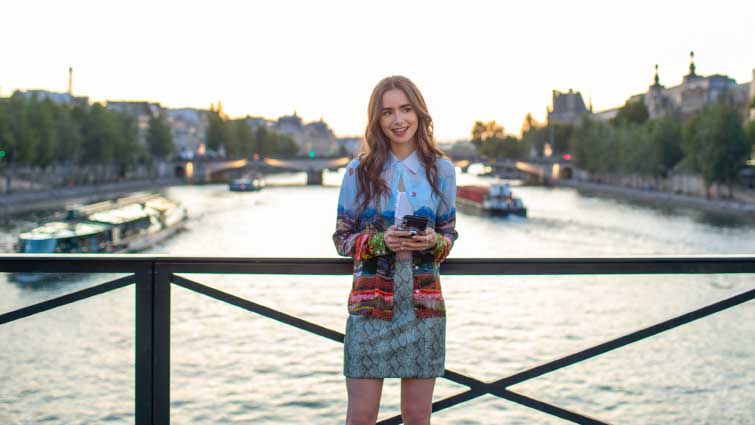 Emily in Paris: Netflix Premiere, Lilly Collins on the Paris bridge.